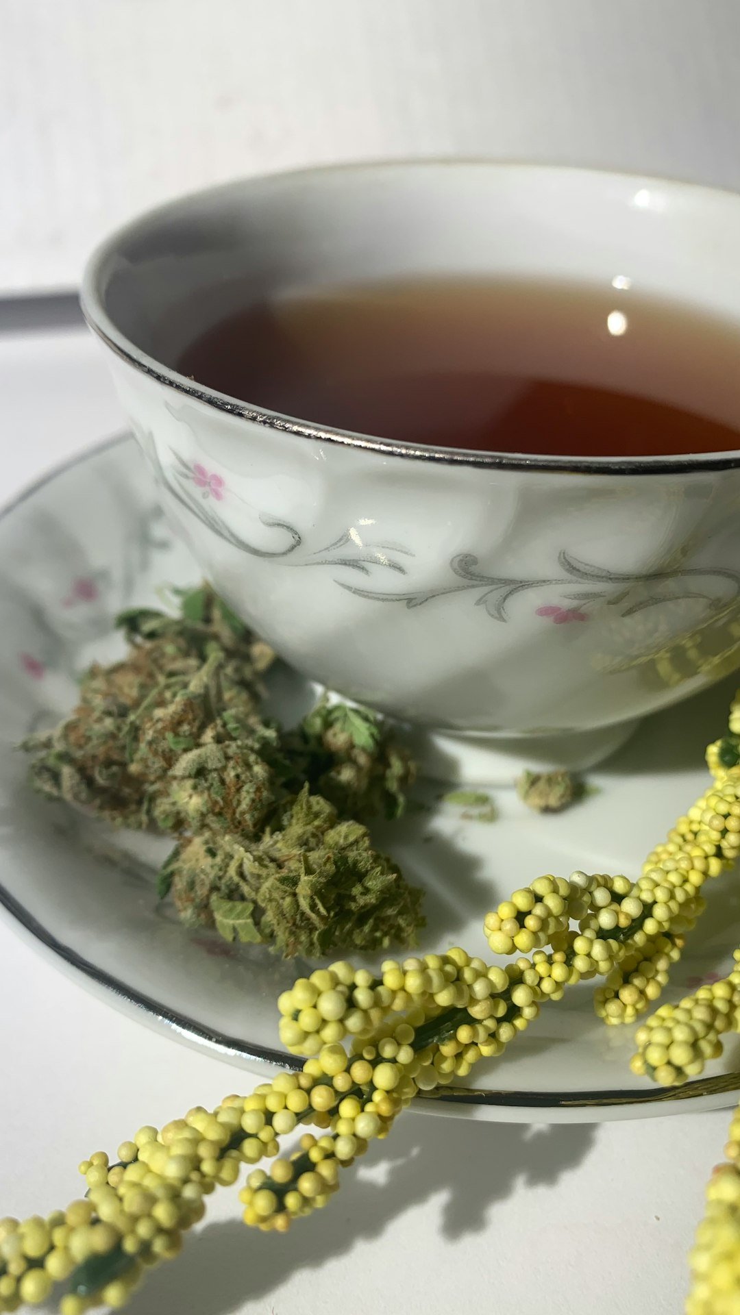 our-story-02 white-and-red-floral-ceramic-teacup-on-white-ceramic-plate-xxgjefbmklc